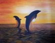 Delfines sobre el mar.jpg